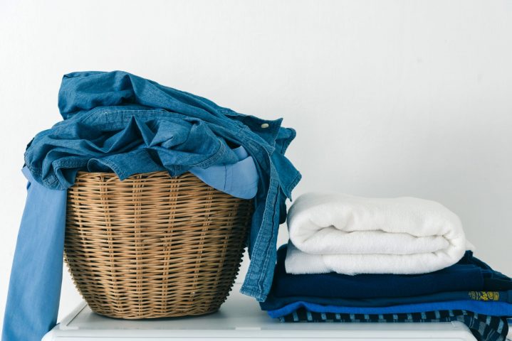 clothing folded and in laundry basket